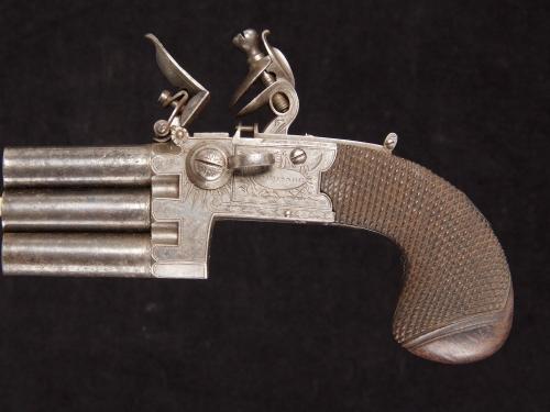 A rare flintlock pocket pistol with three barrels in line_a