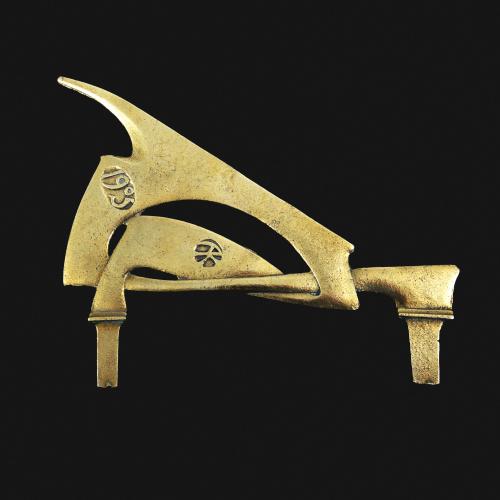 A rare Archibald Knox bronze sundial gnomon or pointer