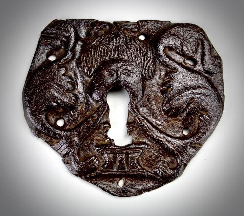 A wrought iron escutcheon