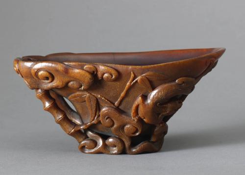 A RHINOCEROS HORN ‘GRAPE VINE’ LIBATION CUP QING DYNASTY, KANGXI PERIOD, CIRCA 1700 