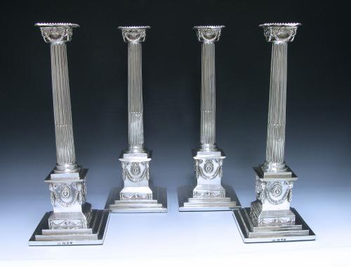 A Set of Four George III Sterling Silver Candlesticks