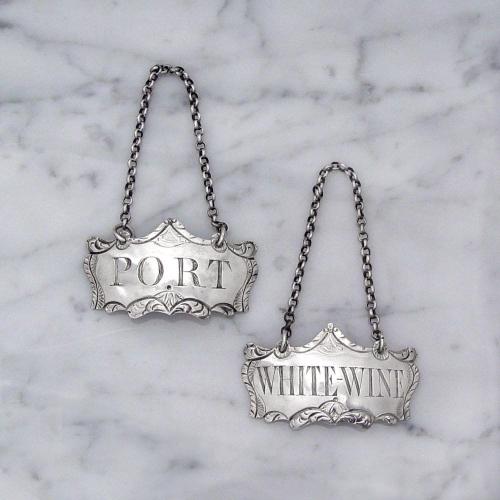 A Pair of George III English Silver Wine Labels by Hester Bateman