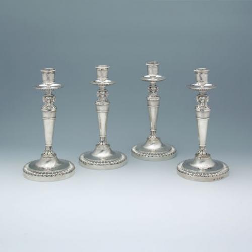 A Set of Four George III Antique English Silver Candlesticks