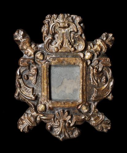 A rare, mid-17th century, Spanish gilded and polychrome carton pierre or papier mache mirror