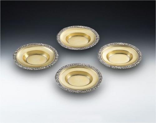 A very fine and rare set of four George III Silver Gilt Dishes made in London in 1817 by Solomon Royes and John East Dix.