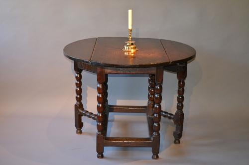 An unusual 17th century oak gateleg tavern table