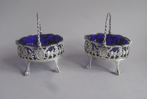 An extremely rare pair of early George III Cast "Basket" Salt Cellars made in London in 1770 by Robert & David Hennell.