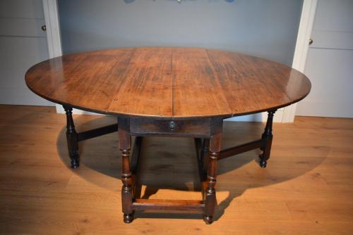 A rare large early George II mahogany gateleg table