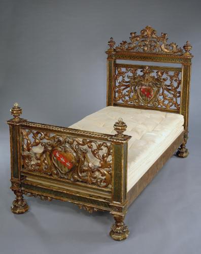 A rare, 19th century, Italian, carved, painted and gilded bed