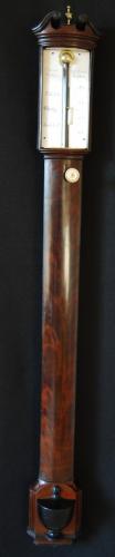 Elliott Brothers - London. 19th Century mahogany bowfront stick barometer