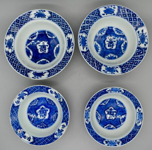 A set of 4 Kangxi blue and white Shou bowls