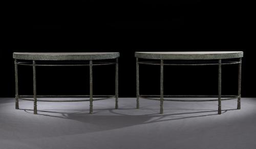 A pair of custom-made bronze console tables with semi-circular tops