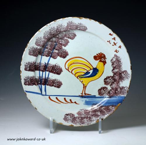 English delftware pottery Farmyard plate with figure of a rooster, early 18th century English