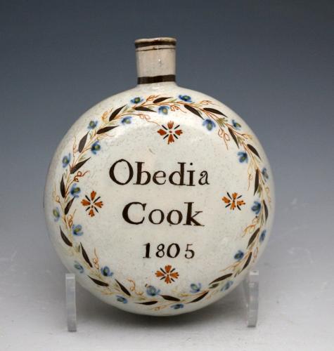 Antique English pottery spirit flask named and dated Obedia Cook 1805 in Pratt colours