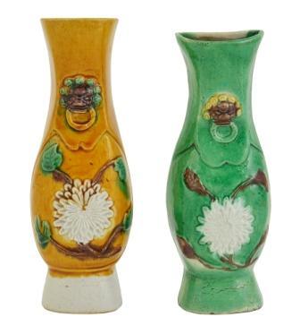 A pair of Biscuit Sansai glazed hanging wall vase