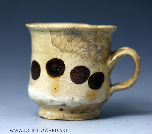 Early English slipware cup with dot decoration early 18th century, probably Staffordshire