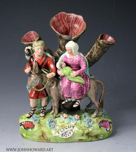 Staffordshire pottery figure group of the Flight to Egypt by Walton, Early 19th century