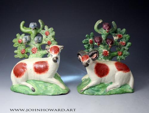 Staffordshire pottery ram and ewe figures the bocage with perched birds