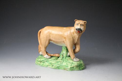Antique Staffordshire pottery figure of a lioness by Dale Pottery