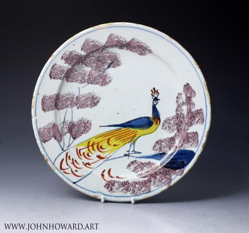 English delftware pottery farmyard plate with a peacock, Bristol delftworks  18th century