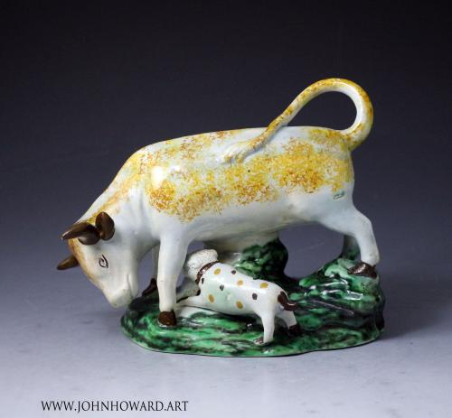 Staffordshire pottery pearlware figure of a bull and terrier on green base, late 18th century England