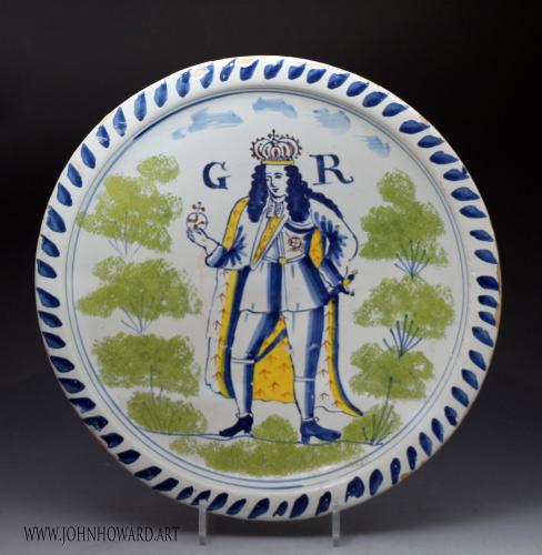 English delftware pottery blue dash charger standing royalty figure of King George 1