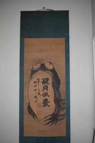 Scroll painting of a wide eyed frog