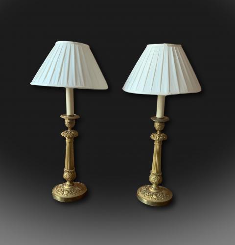 A pair of early 19th century French candlesticks converted to lamps