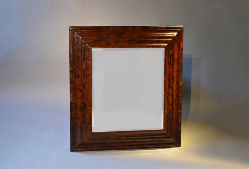 A large William and Mary oyster veneered mirror
