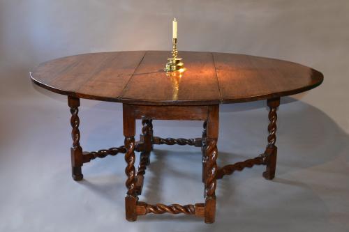 a large Charles II walnut gateleg table