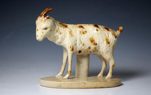 Antique saltglaze buff coloured stoneware figure of a standing goat early 19th century