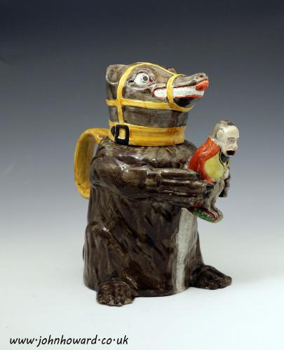Prattware jug and cover figure of a Bear hugging Napoleon depicted as a monkey Circa 1812