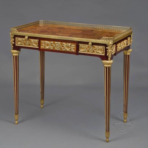 A Louis XVI Style Mahogany and Marquetry Writing Table After The Model by Jean-Henri Riesener
