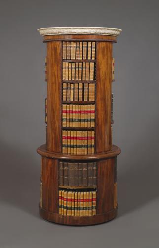 A Most Unusual Mahogany Circular Bookcase Surmounted By A Statuary Dished Marble Top With Finely Carved Ogee Edge 