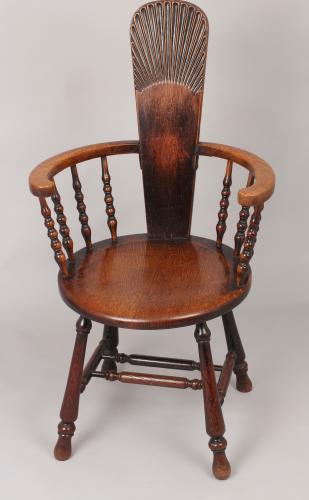 Early 20th century oak arm-chair of unusual form