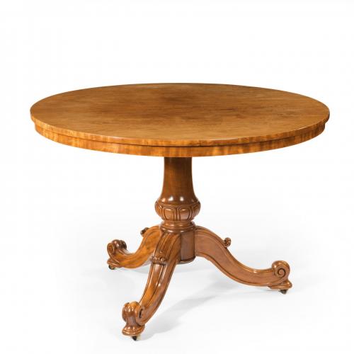 A mid-Victorian faded satinwood centre table