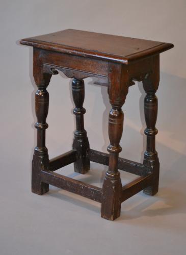 An elegant mid 17th century oak joint stool