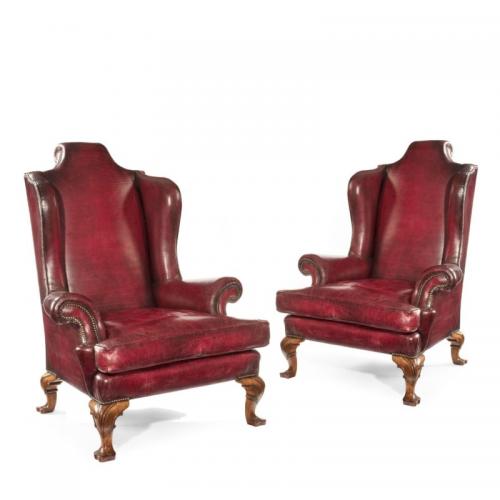  Pair of George II style wing arm chairs