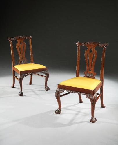 A pair of  mid 18th century carved mahogany side chairs