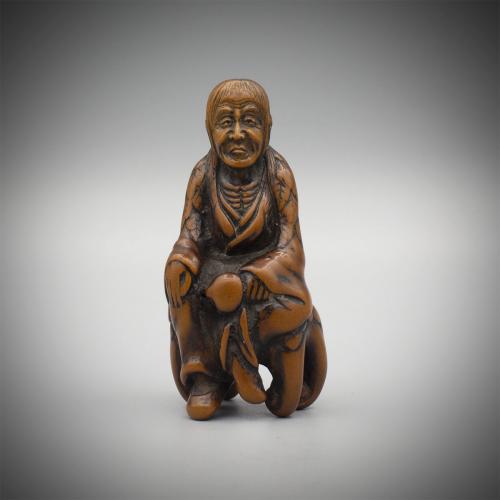 Early Wood Netsuke of Tobosaku Sennin