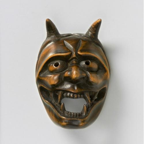 Boxwood mask netsuke of Ja, by Harumitsu
