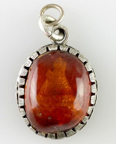 Amber IHS amulet, German, late 17th century