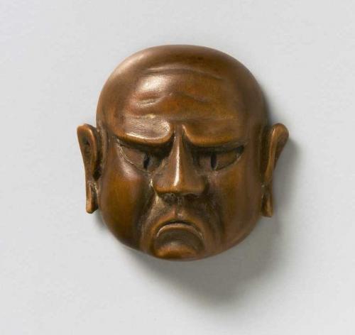Wood mask netsuke of a Grimacing Man 
