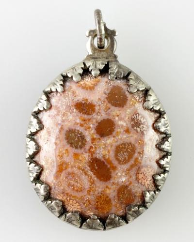 Fossilised coral Pieta amulet. German, early 17th century