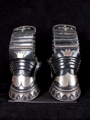 An exceptional pair of black and white mitten gauntlets_a