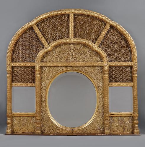 A Rare Giltwood Overmantel Mirror Set With Panels Of Mughal Inspired Carved Geometric Tracery
