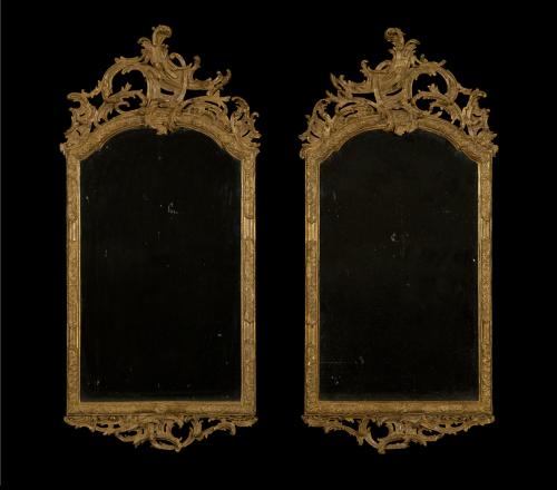 A Superb Pair Of Eighteenth Century Giltwood And Partial Composition Rococo Mirrors Of Complimentary Asymmetrical Design In The Manner Of Ferdinand Hundt (1703–1758)