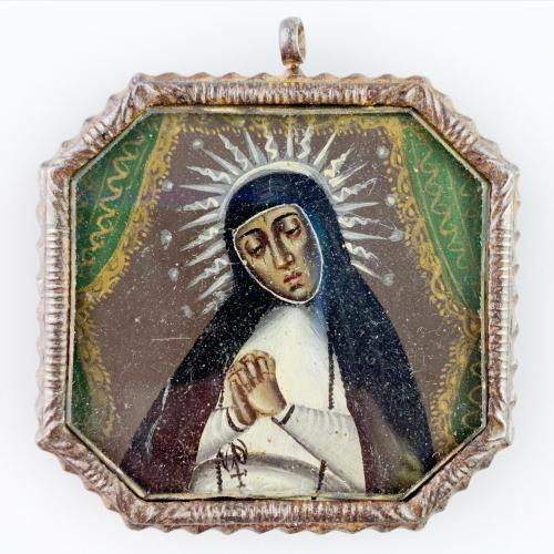 Iron pendant containing oil on copper nun saint. Spanish America, 17th century