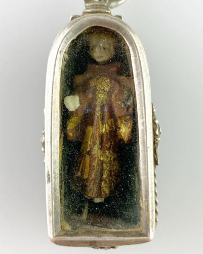 Silver pendant with a miniature carving of Saint Anthony. Spanish, 17th century