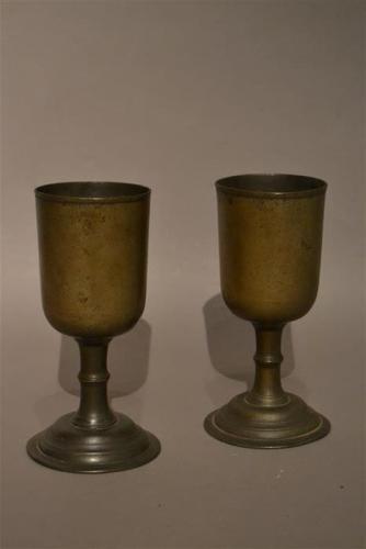 A pair of late Georgian pewter chalices